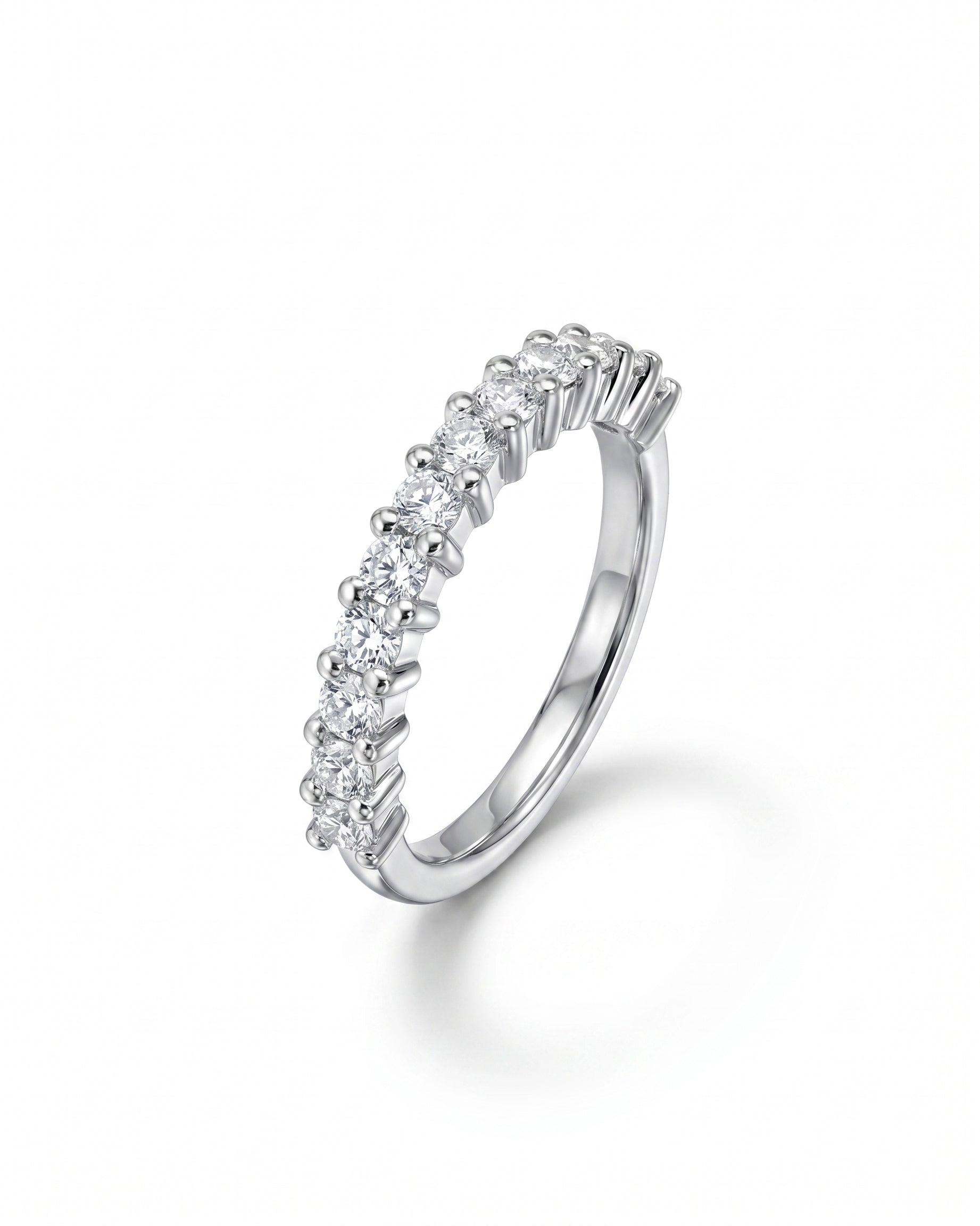 Silver claw set diamond half eternity ring.
