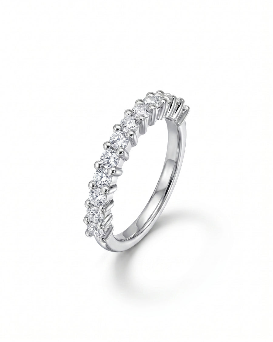 Silver claw set diamond half eternity ring.
