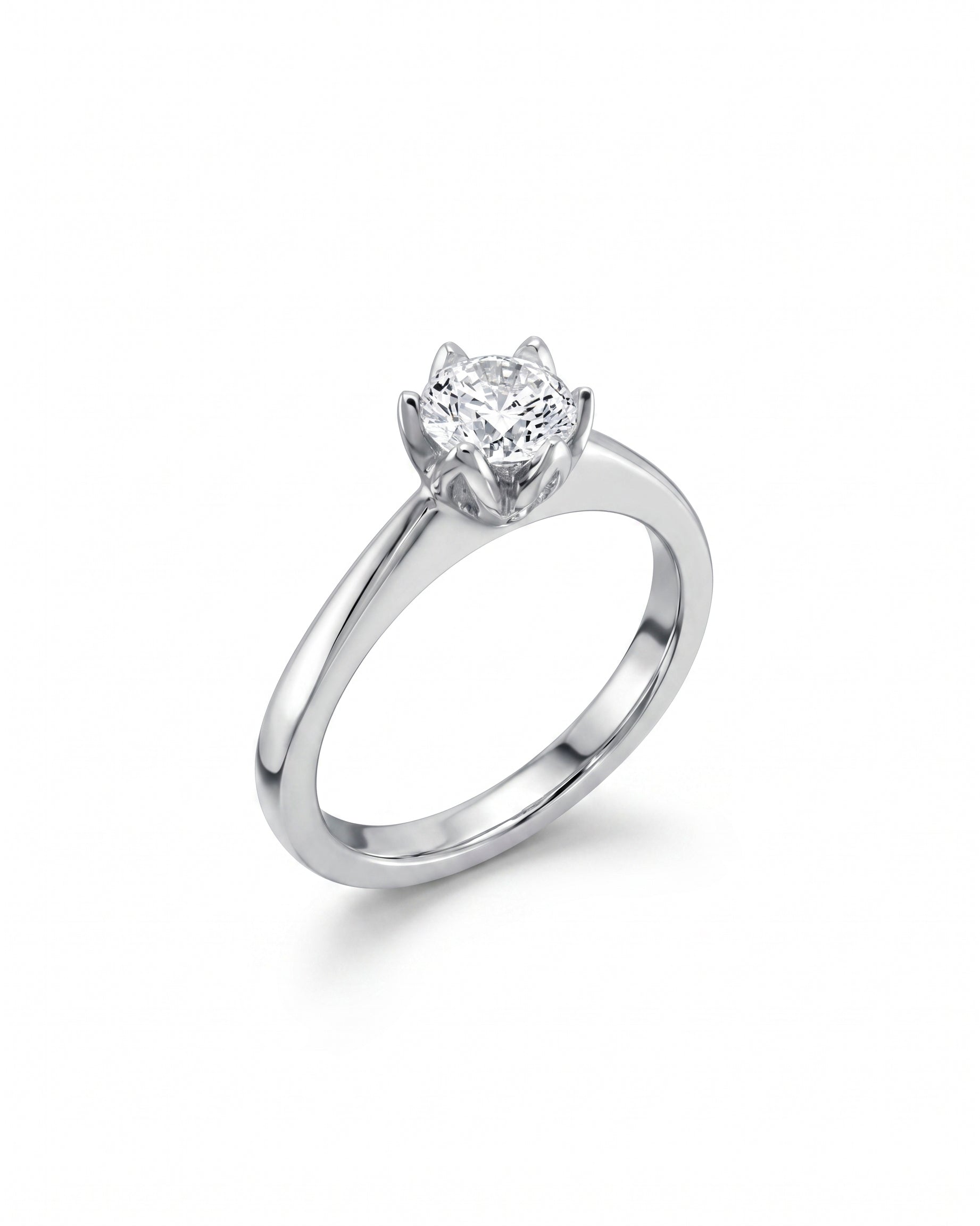 Platinum engagement ring with a round, claw-set diamond.
