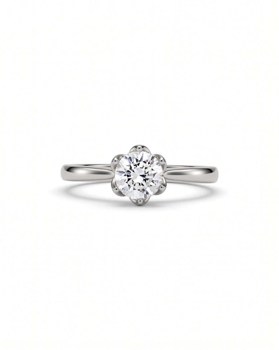 Platinum engagement ring with a round diamond in a claw setting.