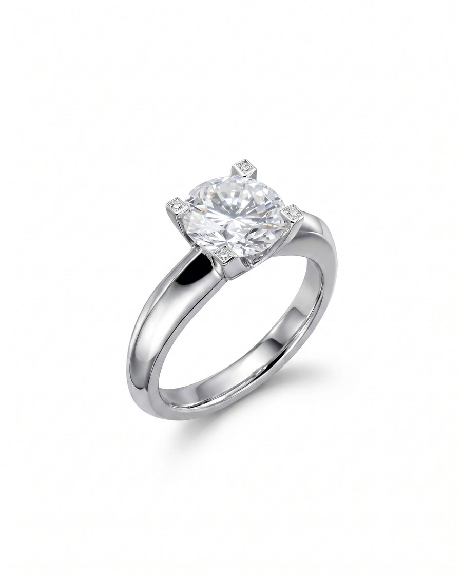 Silver claw set round brilliant diamond engagement ring.