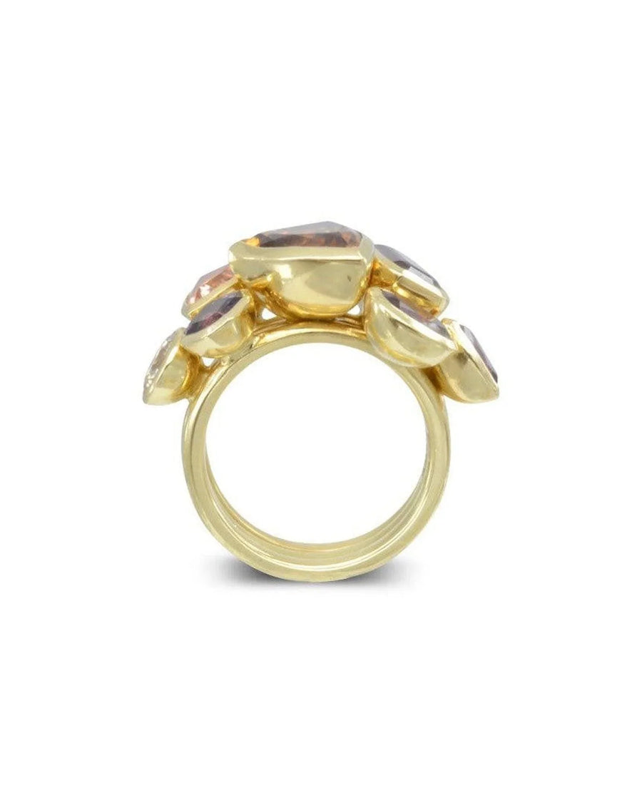 Yellow gold stacking rings with faceted gemstone clusters, modern artistic design