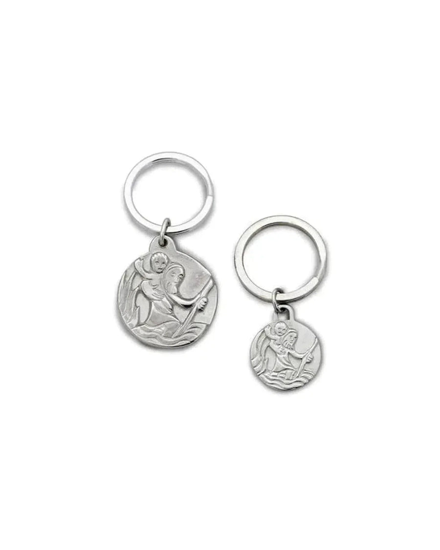 Two silver St. Christopher pendants with detailed relief, shown on white background