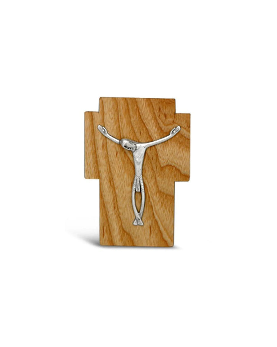 Handcrafted wooden cross with silver-tone crucifix on natural wood grain background