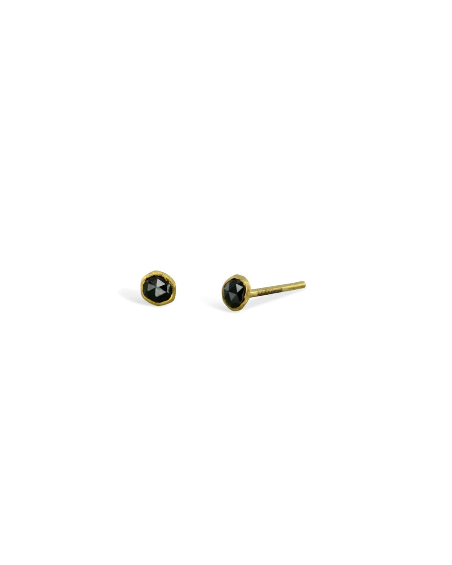 18ct yellow gold stud earrings with rough black spinel gemstones.