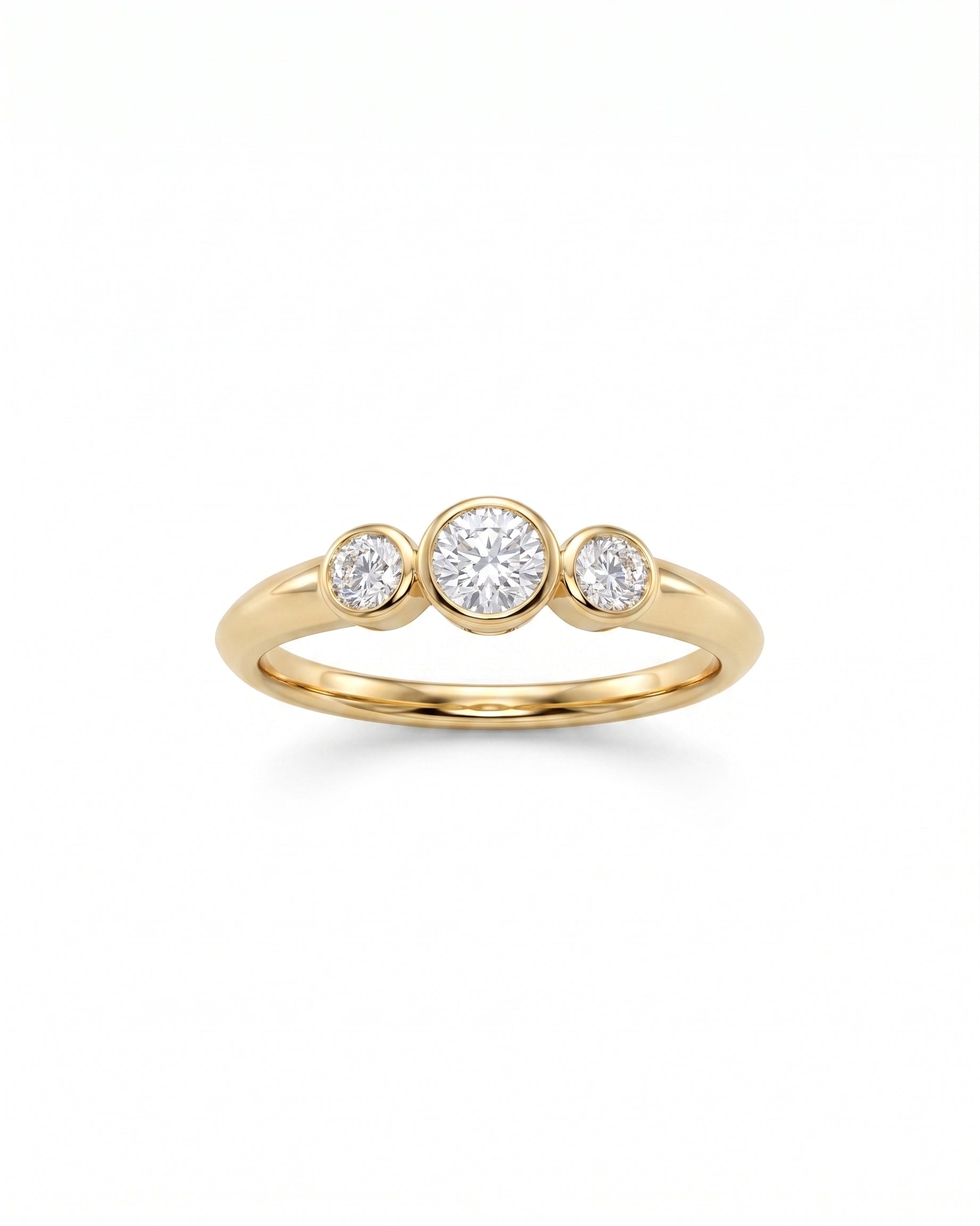 9ct gold trilogy ring with three round bezel-set diamonds.