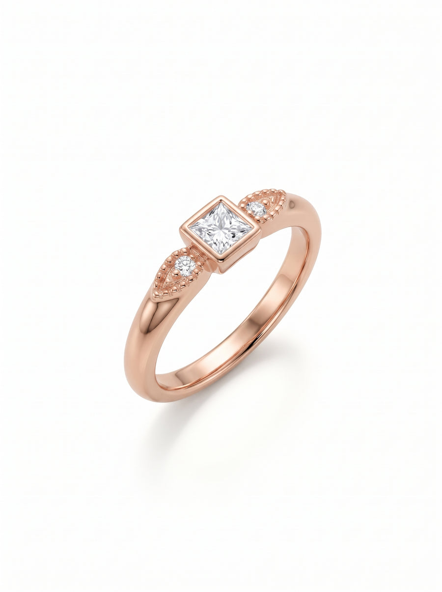 Rose gold engagement ring featuring a square princess-cut diamond and two small round accent stones.