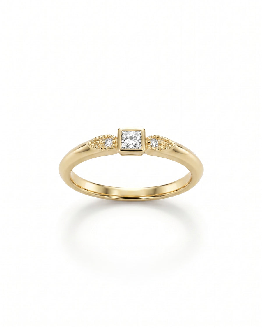 Gold engagement ring with a square diamond and two small round diamonds.
