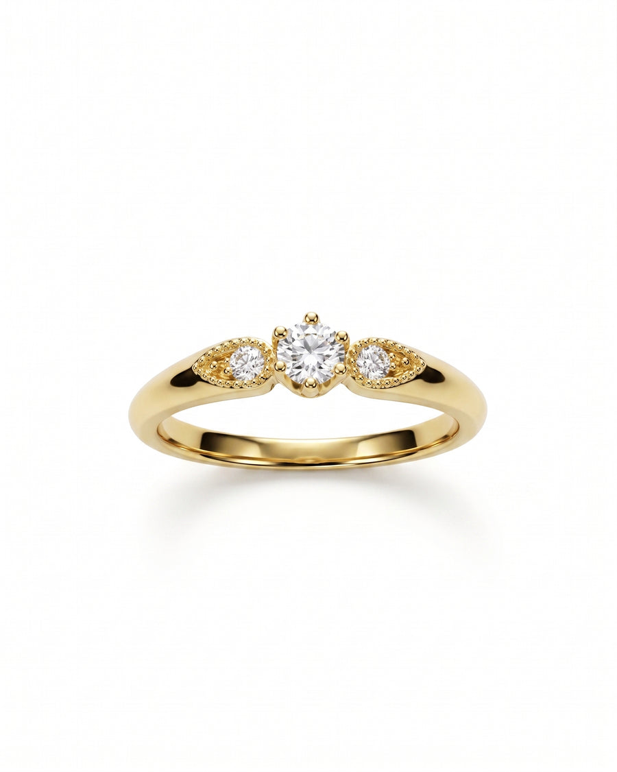 Gold vintage shoulder engagement ring with three round diamonds.