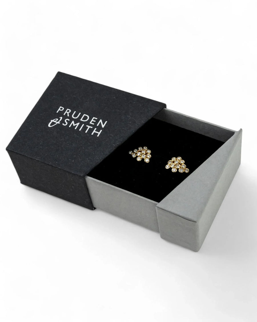 Yellow gold diamond cluster stud earrings in a black and grey gift box
