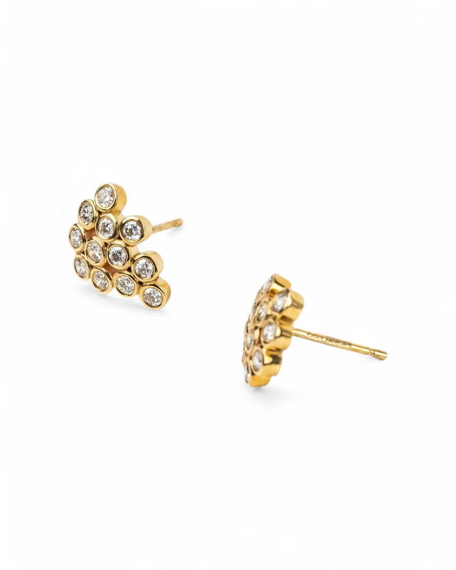 Yellow gold cluster stud earrings with diamond bubble design on white background