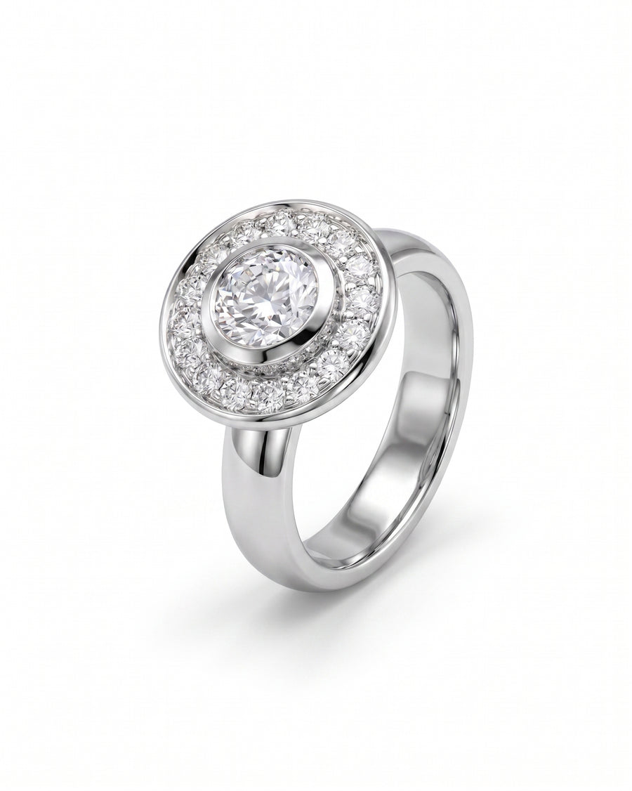 White gold engagement ring with a round diamond cluster design.