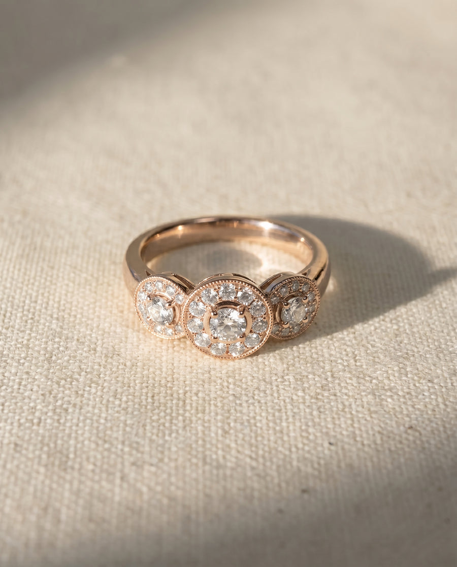 18ct rose gold trilogy cluster engagement ring with diamonds.