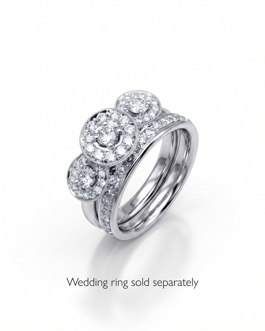 White gold trilogy cluster engagement ring with diamonds.