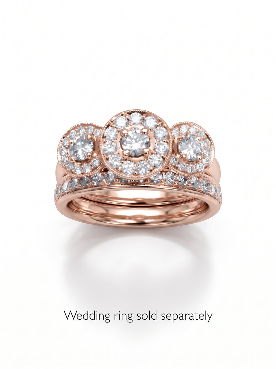Rose gold trilogy engagement ring featuring three round diamond halo clusters and a matching diamond band.