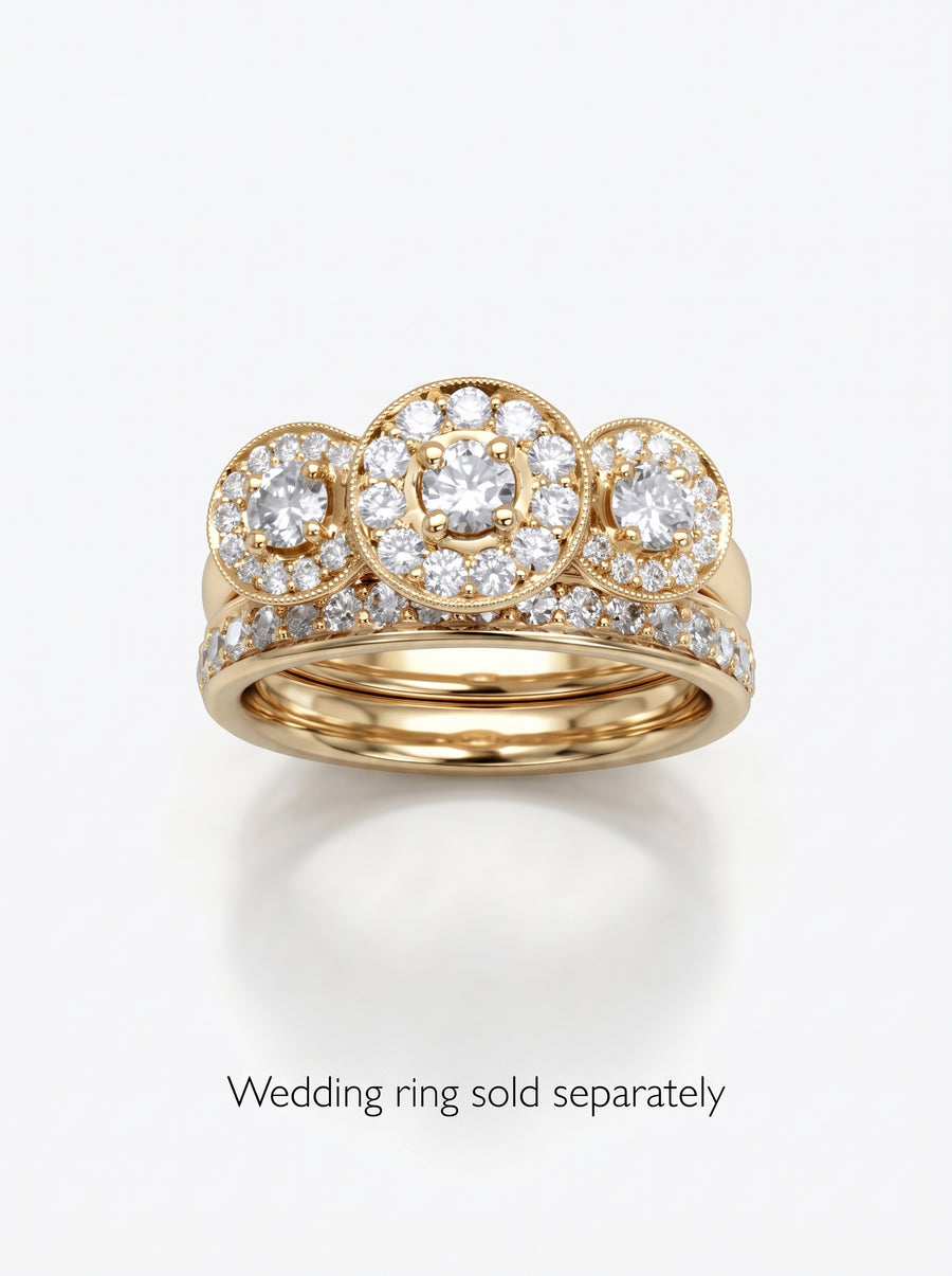 Yellow gold trilogy engagement ring featuring three round diamond cluster settings with milgrain detailing.