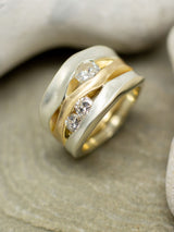 Bold trap eternity ring on a stone background