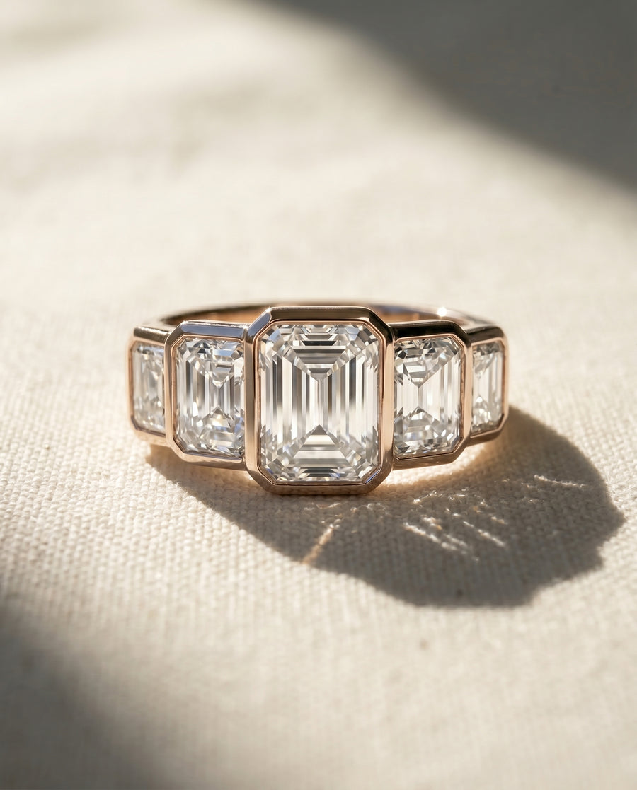 18ct rose gold ring with five emerald cut lab grown diamonds.