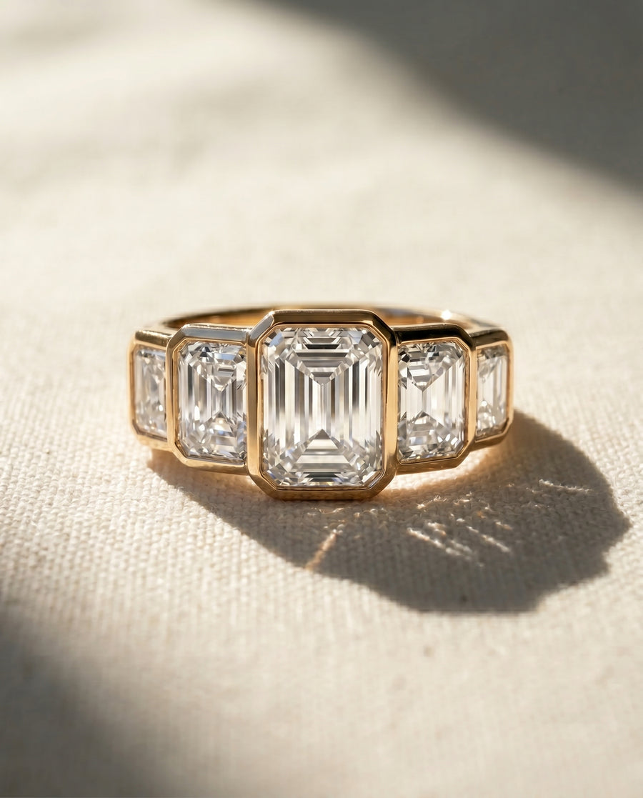 18ct yellow gold ring with five emerald cut lab grown diamonds.
