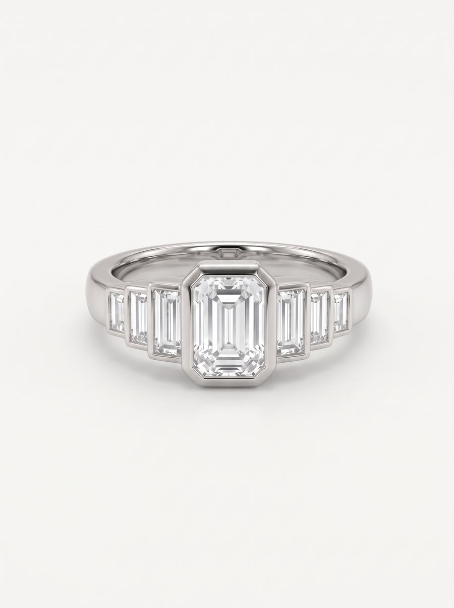 Platinum engagement ring featuring a central emerald cut diamond flanked by six baguette cut diamonds.