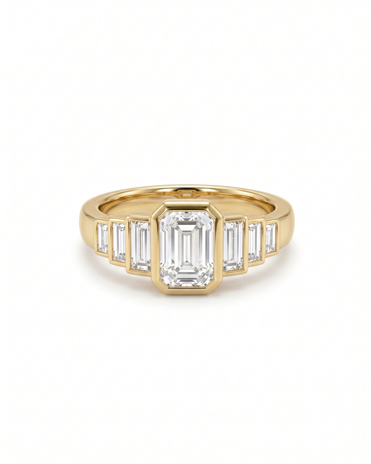 Gold engagement ring featuring a central emerald-cut diamond flanked by six baguette-cut diamonds in a bezel setting.