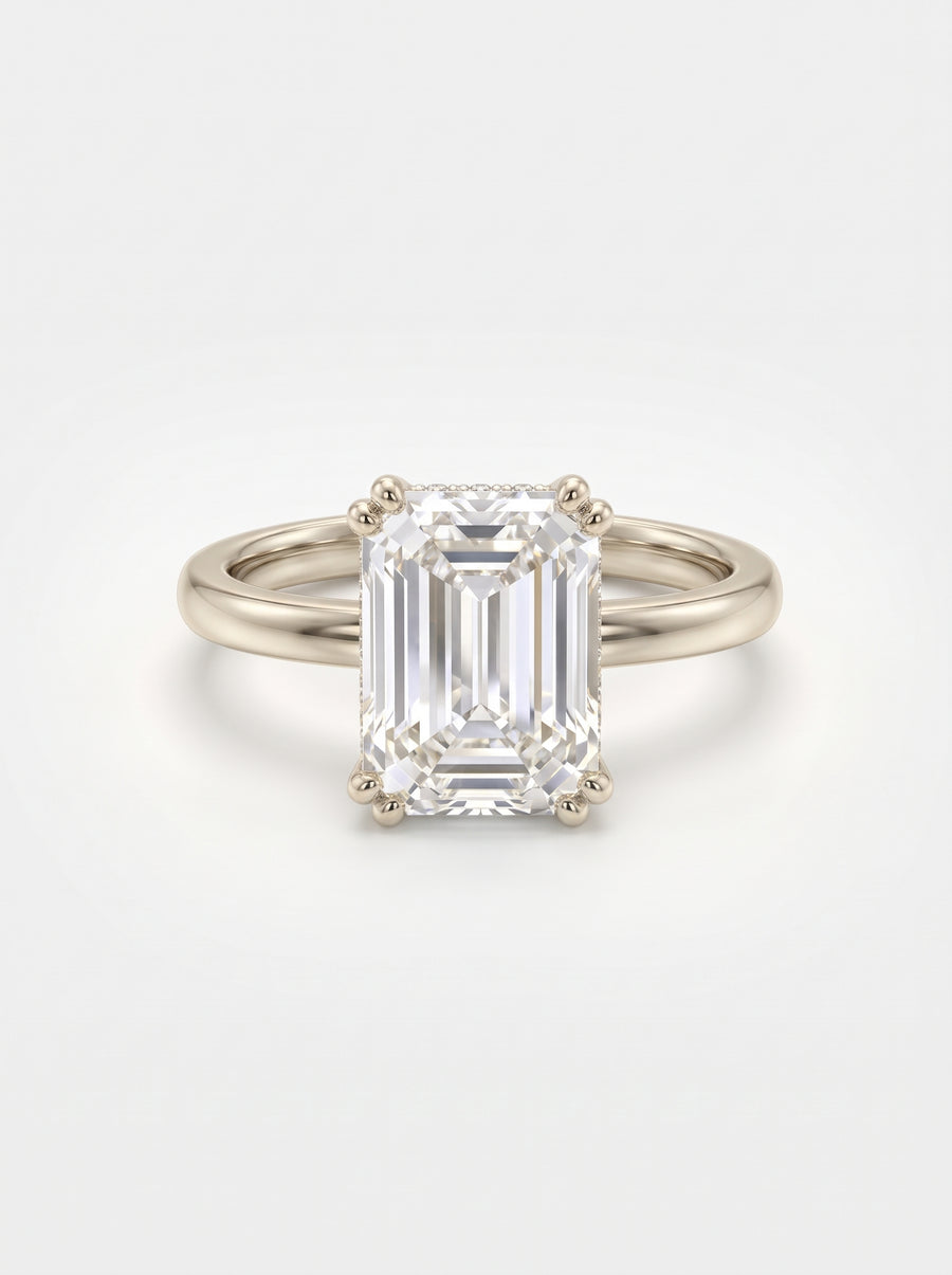 Emerald cut diamond engagement ring with a hidden halo set in 9ct white gold.