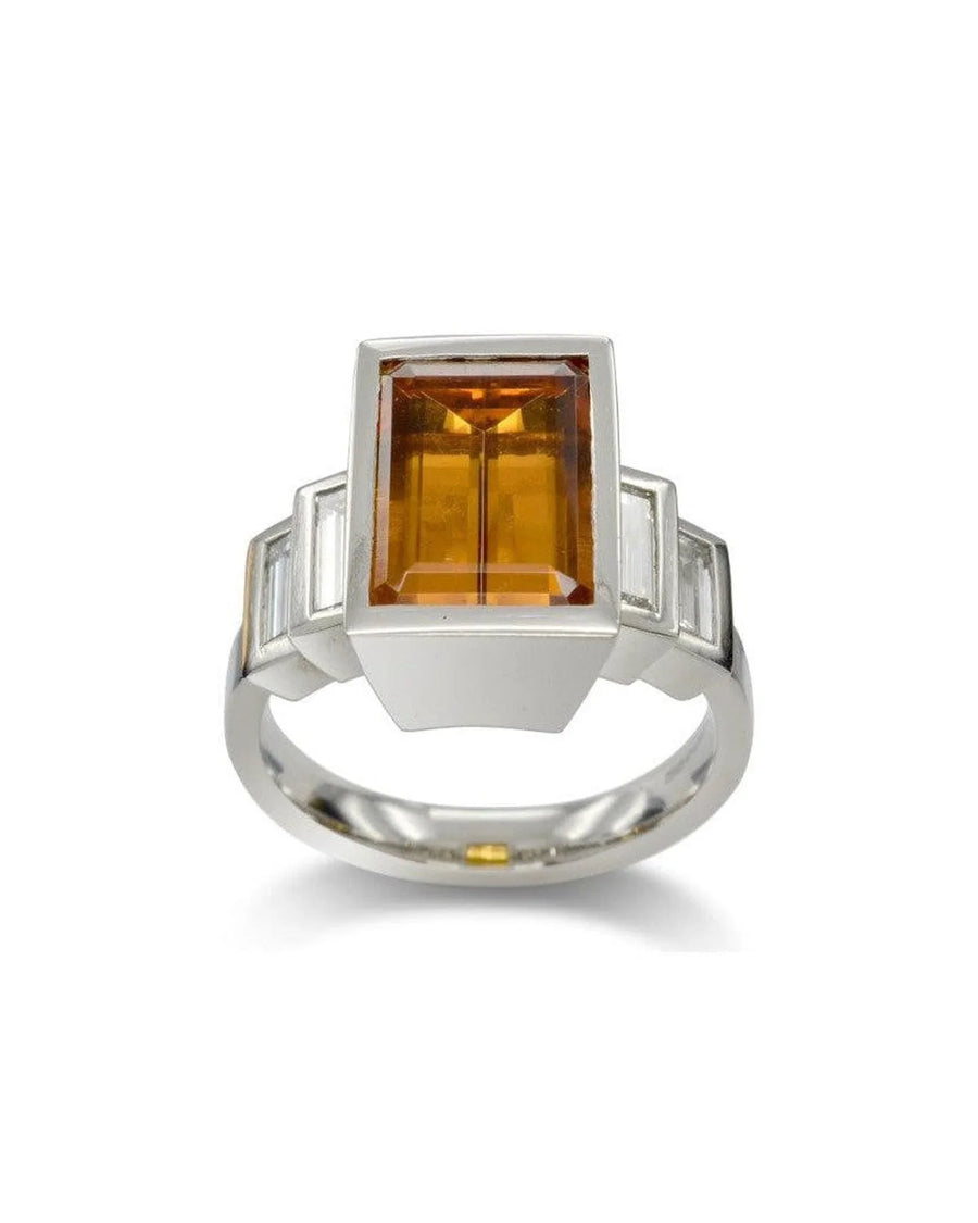 Platinum ring with emerald-cut yellow topaz and diamond accents