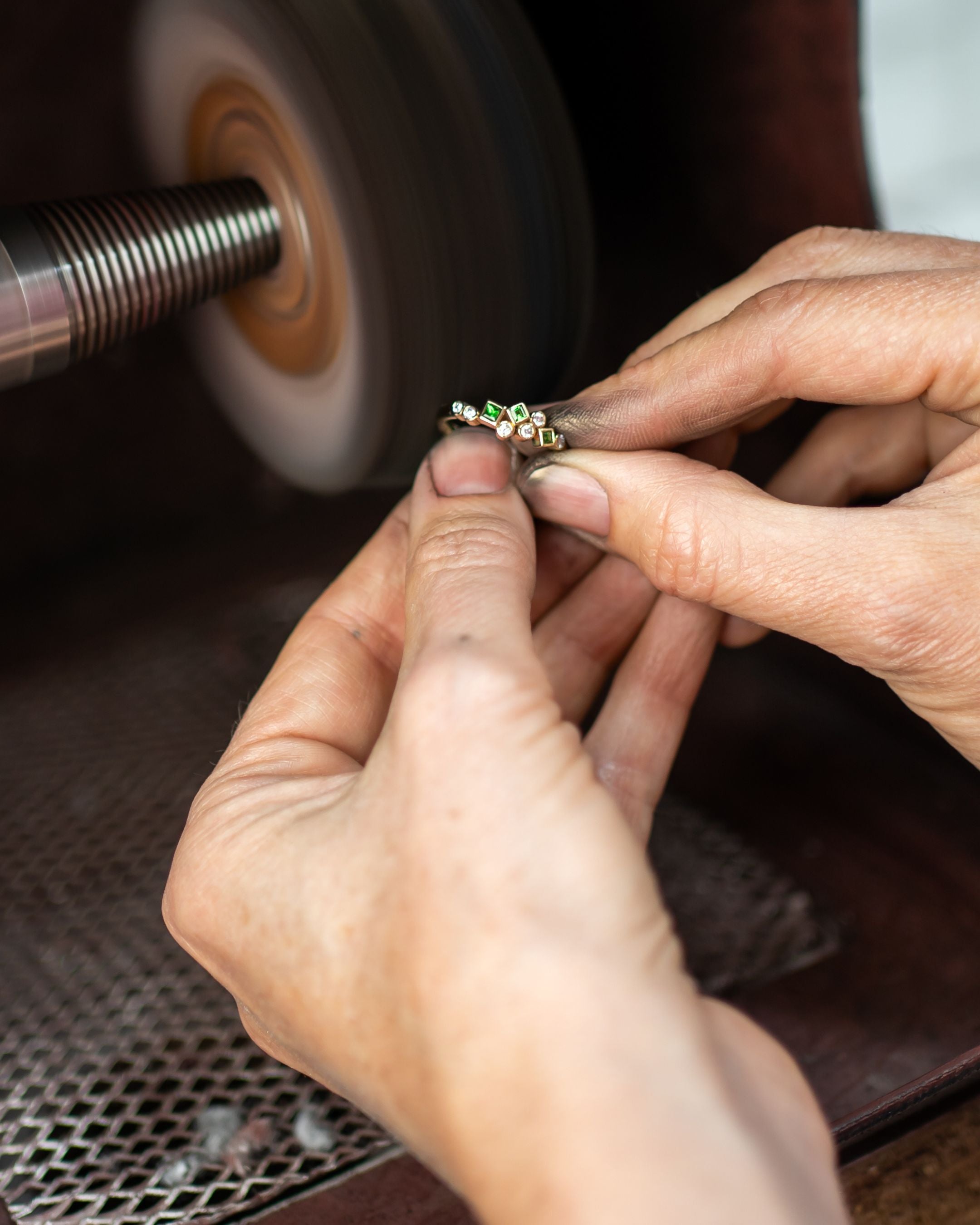 emerald ring being polished