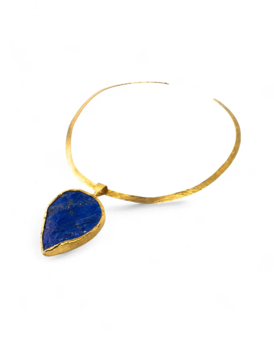 Gold neck torc with teardrop-shaped blue lapis lazuli pendant on white background