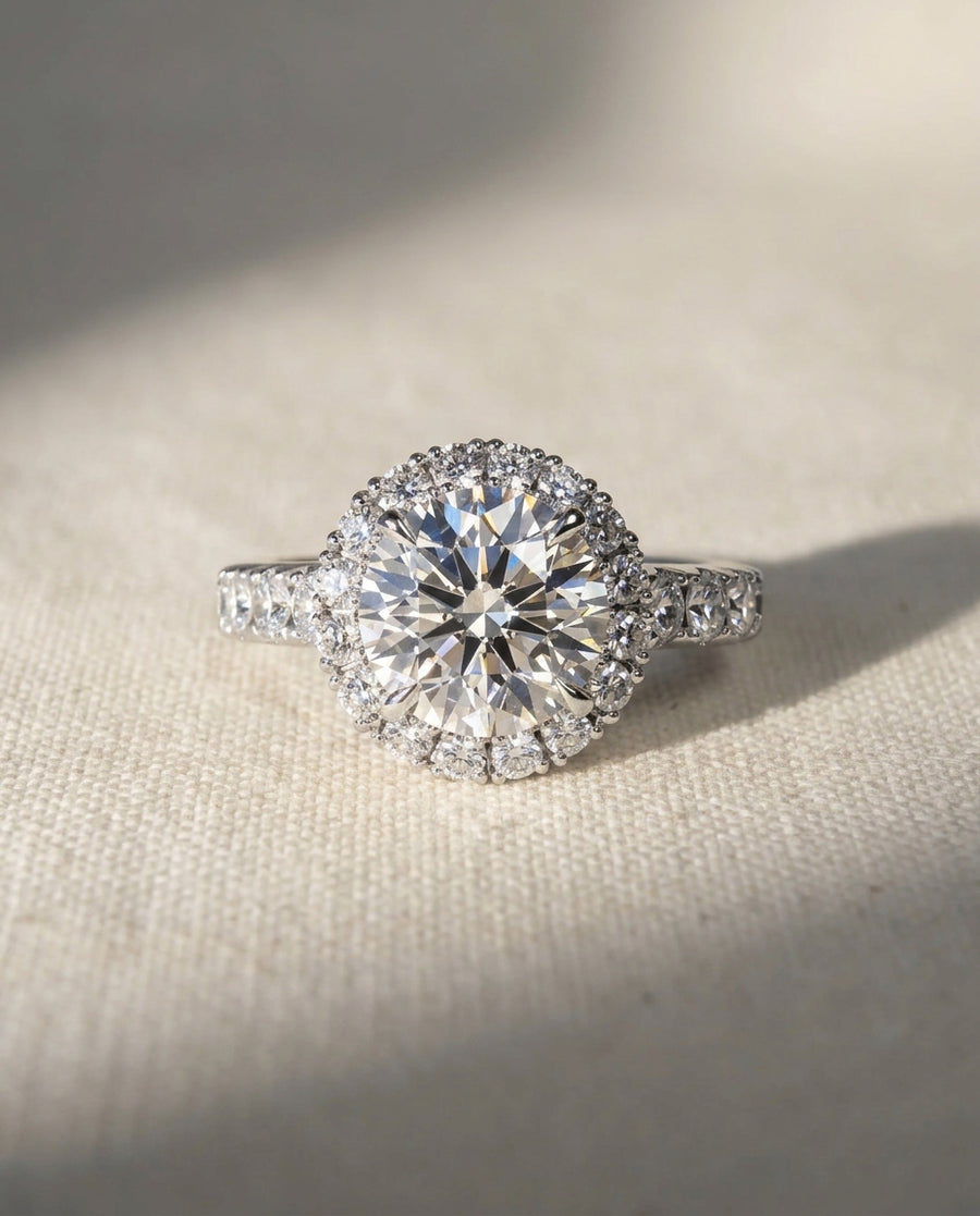 Platinum engagement ring with a round lab grown diamond and halo.