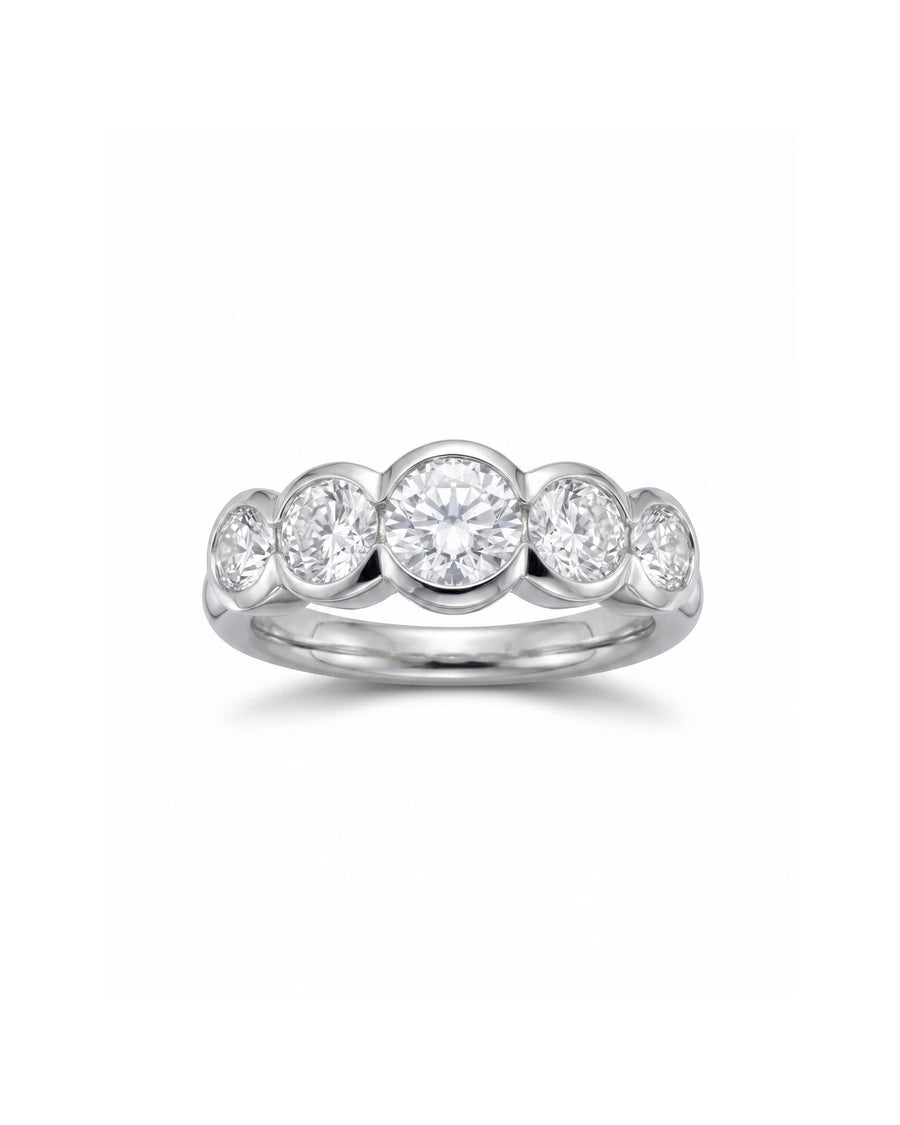 White gold eternity ring with five round brilliant cut diamonds.