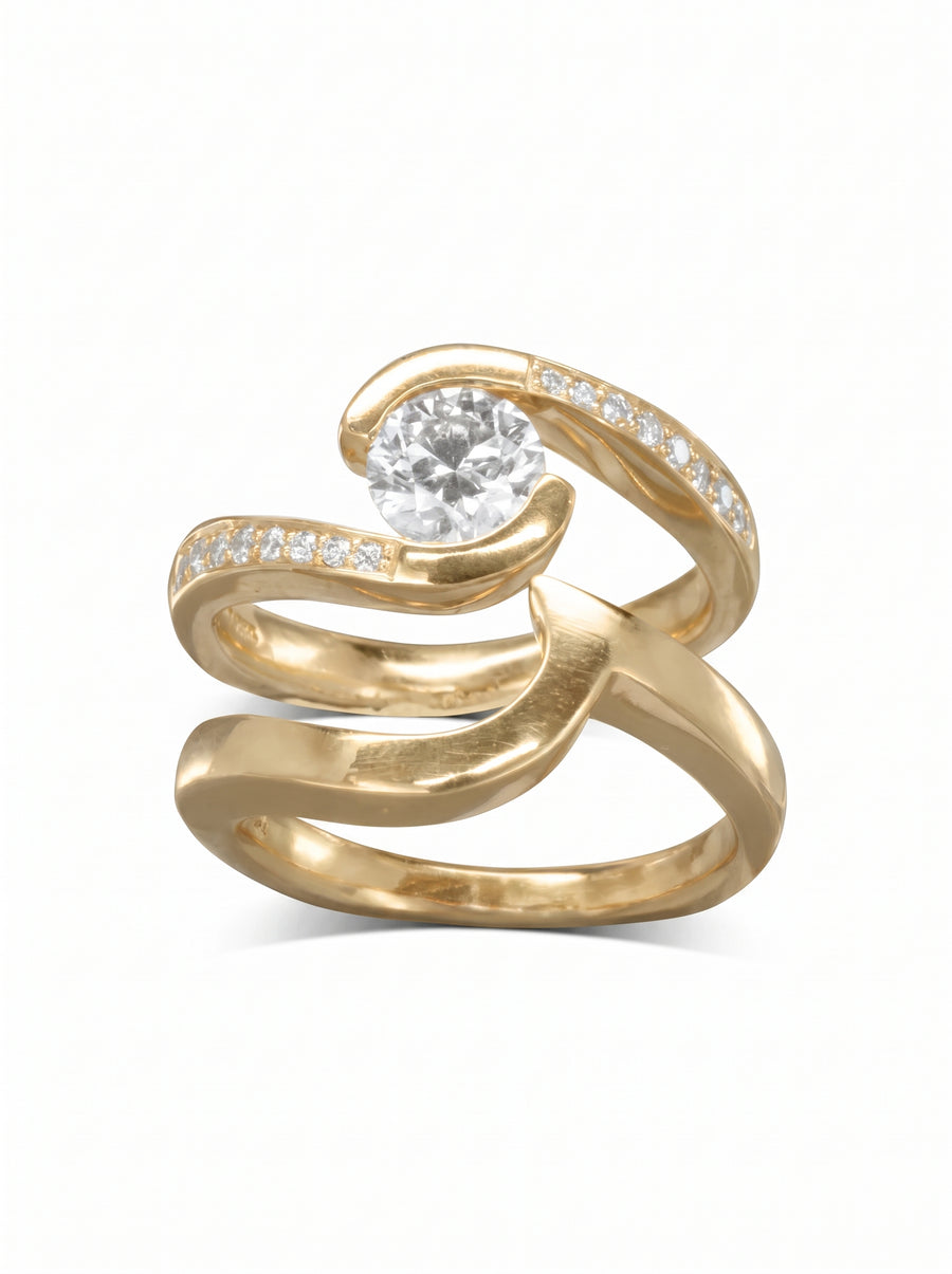 Yellow gold engagement and wedding band set with a twisted design and round diamond accents.