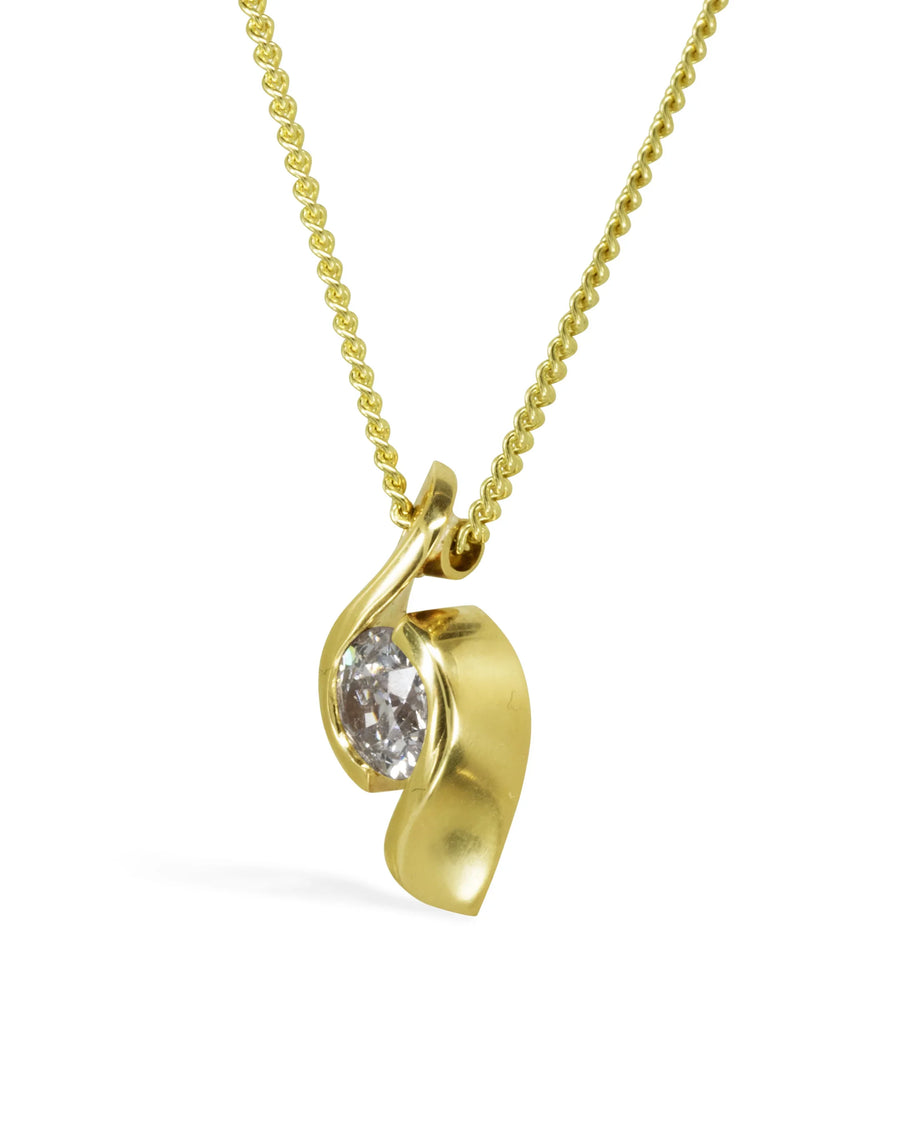Yellow gold chain necklace with a twisting organic gold pendant set with an oval diamond