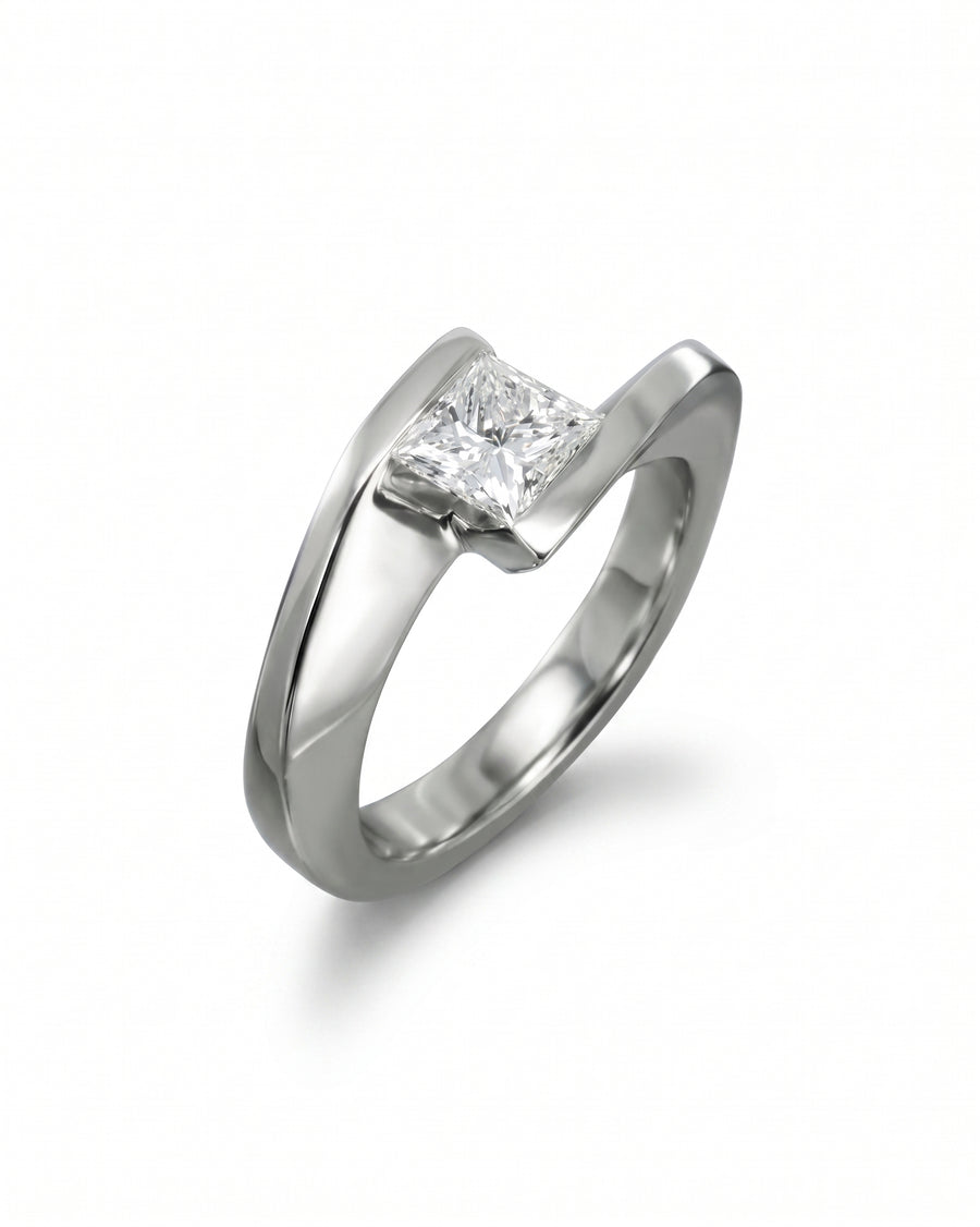 Platinum flat twist engagement ring with a princess cut diamond.