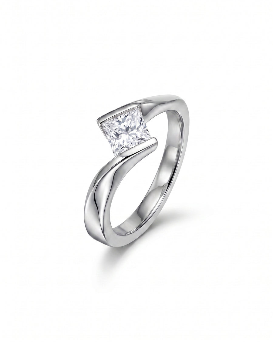 Silver flat twist engagement ring with a princess cut diamond.