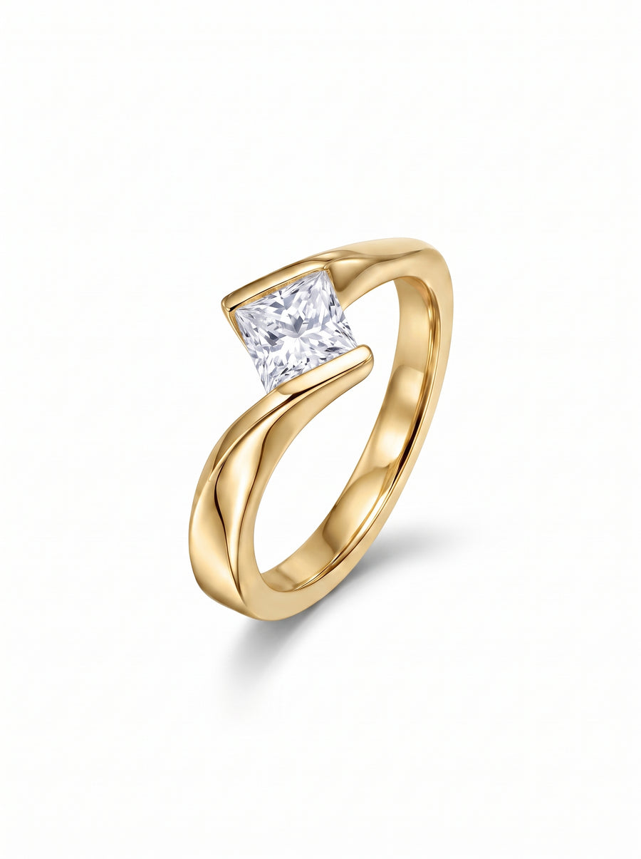 Princess cut diamond engagement ring with a flat twist yellow gold band.