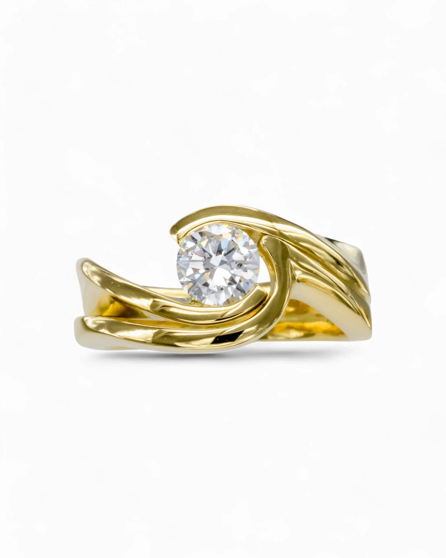 Yellow gold flat twist engagement and wedding band set with a round diamond.