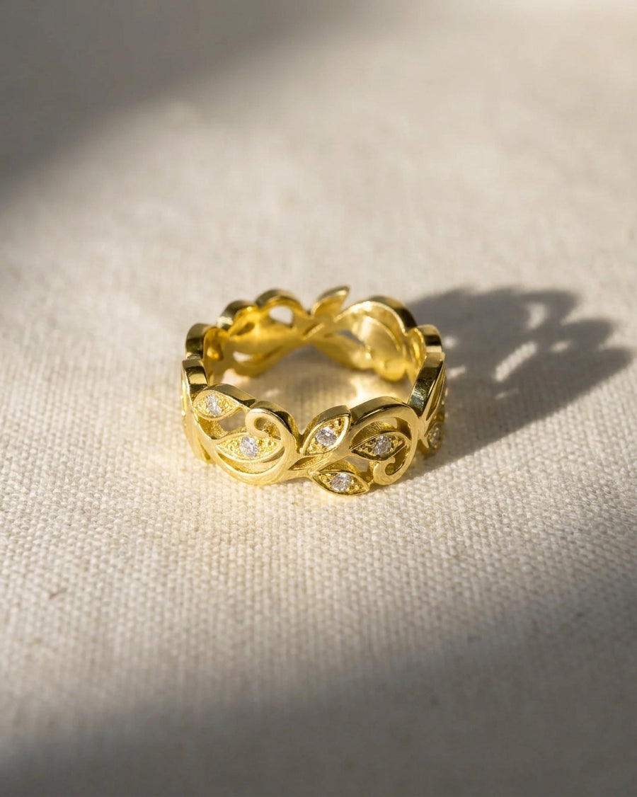 18ct yellow gold floral ring with small diamonds.