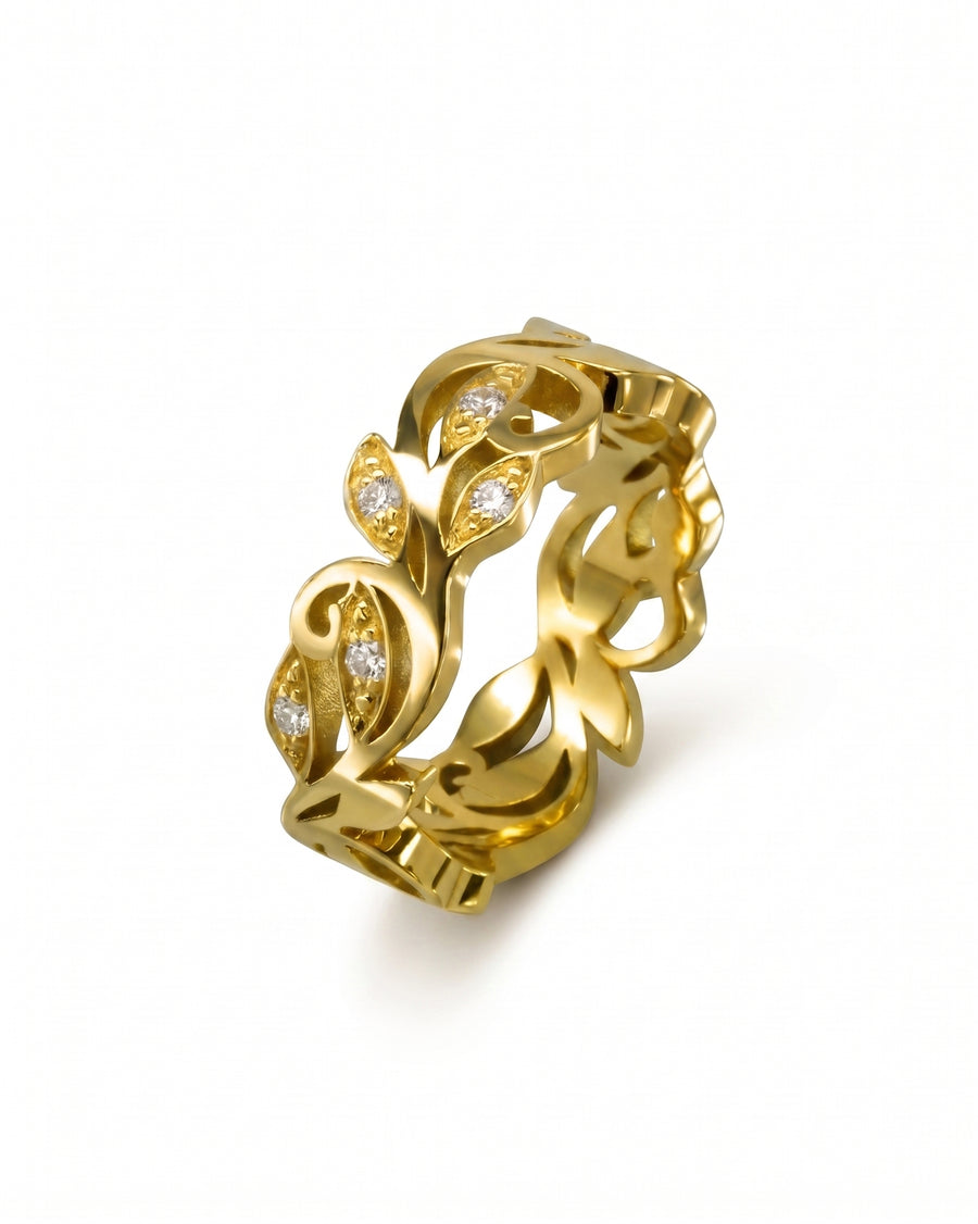 Gold floral diamond ring with leaf design.