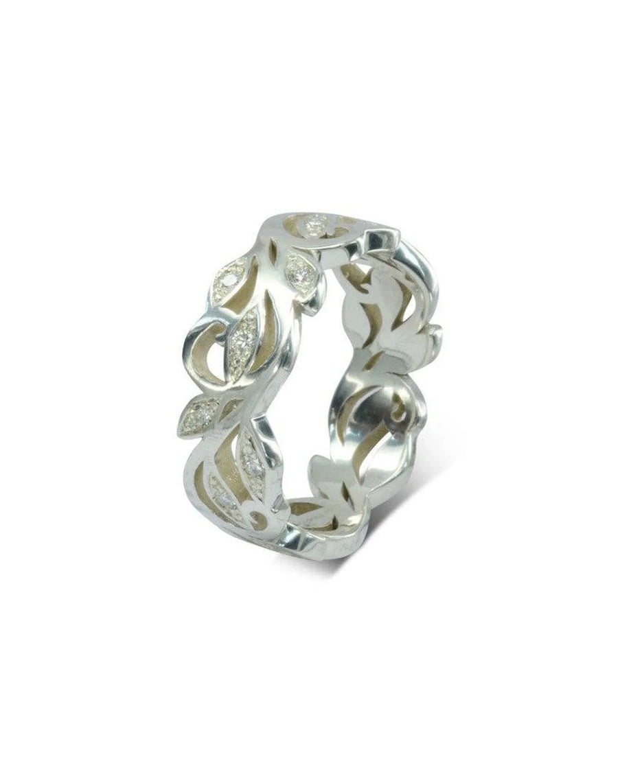 Silver floral diamond ring with leaf-shaped cutouts.