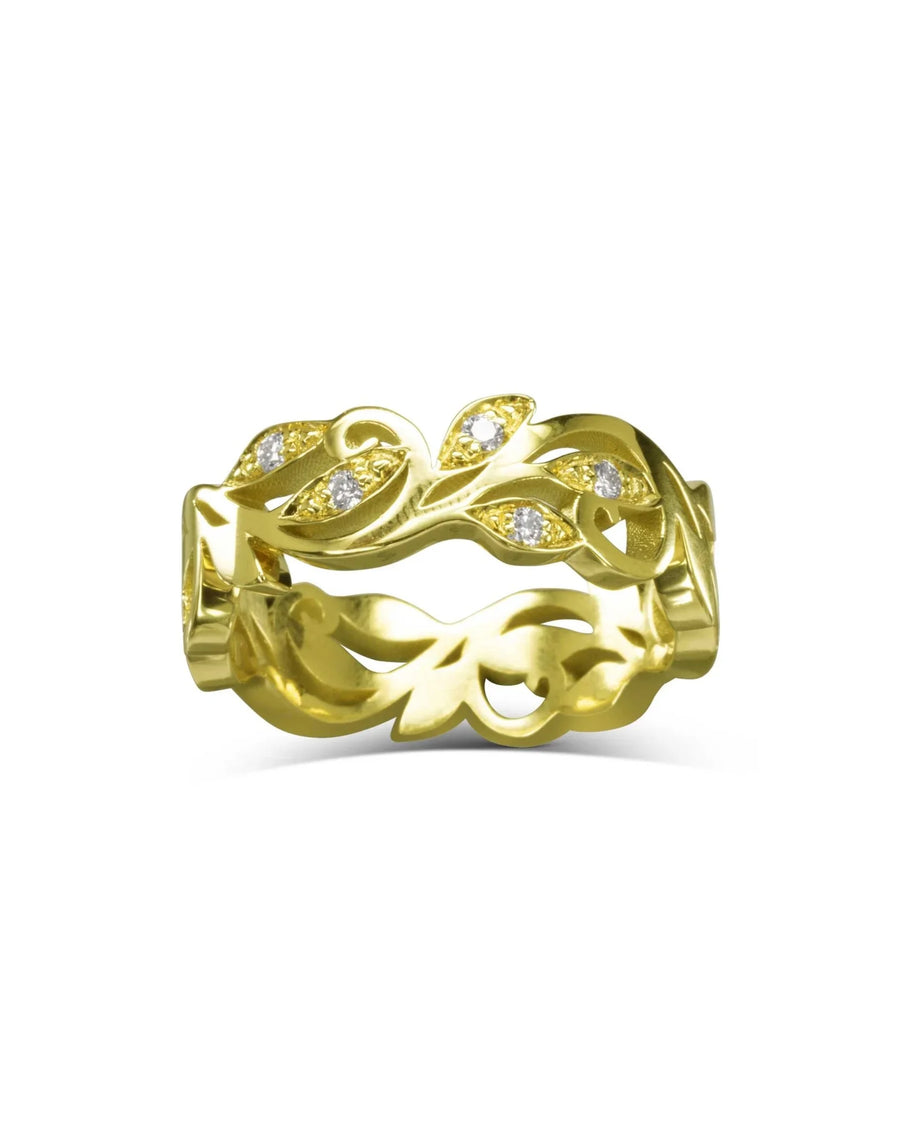 Gold floral diamond ring with leaf design.