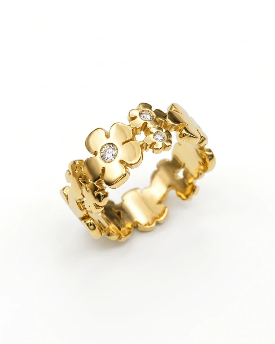 Gold flower eternity ring with diamonds.