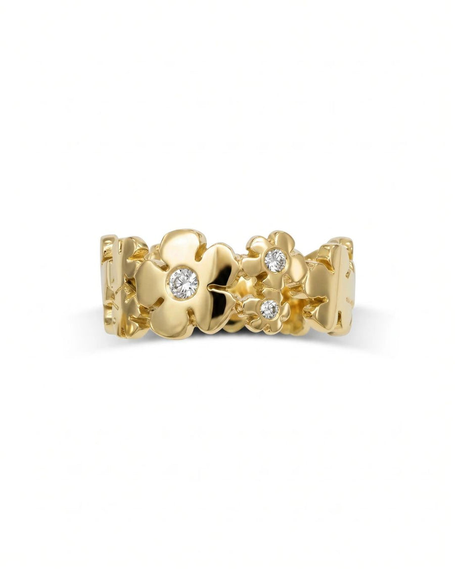Gold flower eternity ring with diamond centers.