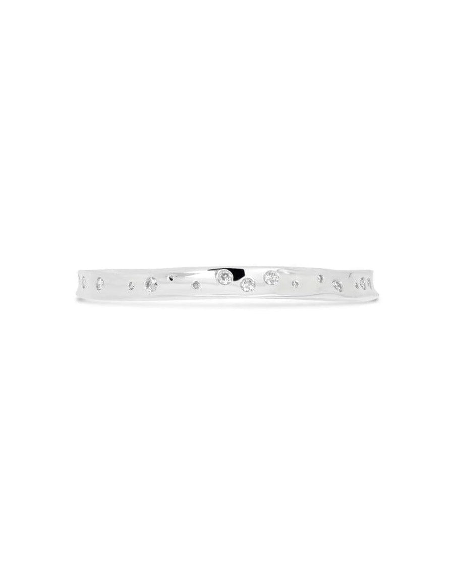 Solid silver bangle with scattered diamonds and a hammered organic texture