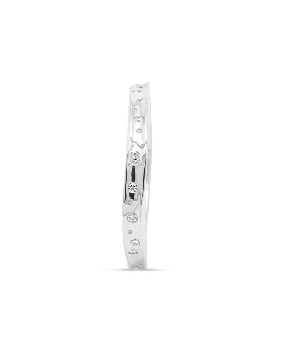 Handmade hammered solid silver bangle with scattered diamonds and organic texture