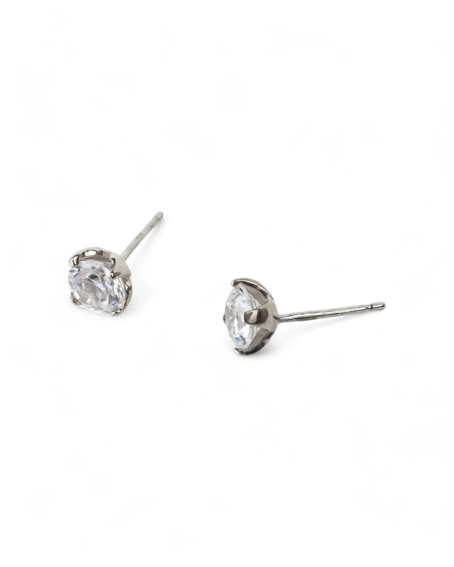 Silver four claw diamond stud earrings.