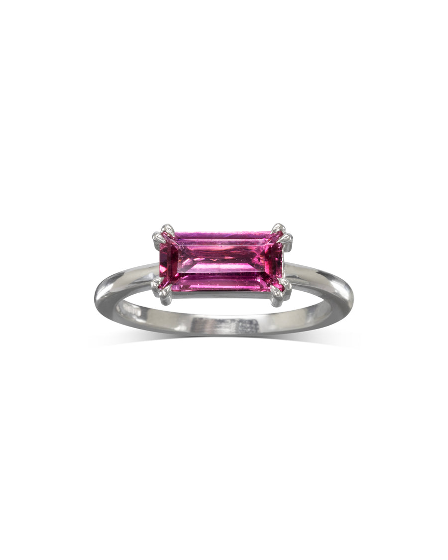 Silver ring with a horizontal pink baguette gemstone.