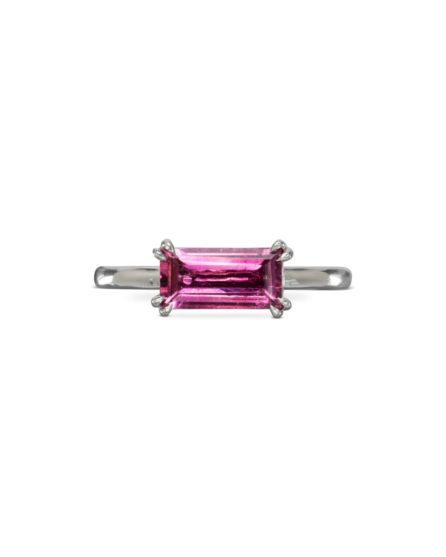 Silver ring with a pink baguette gemstone.
