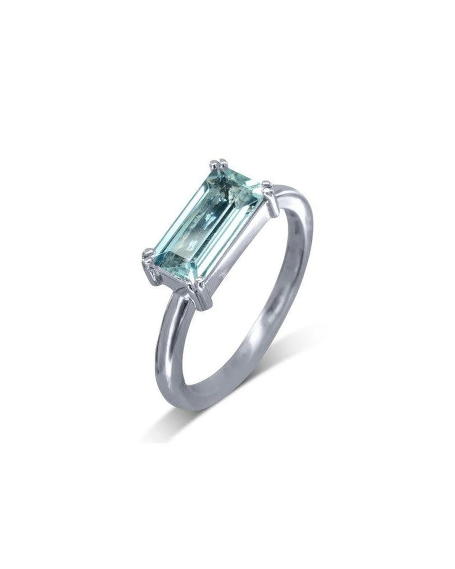 Silver ring with a rectangular light blue gemstone.