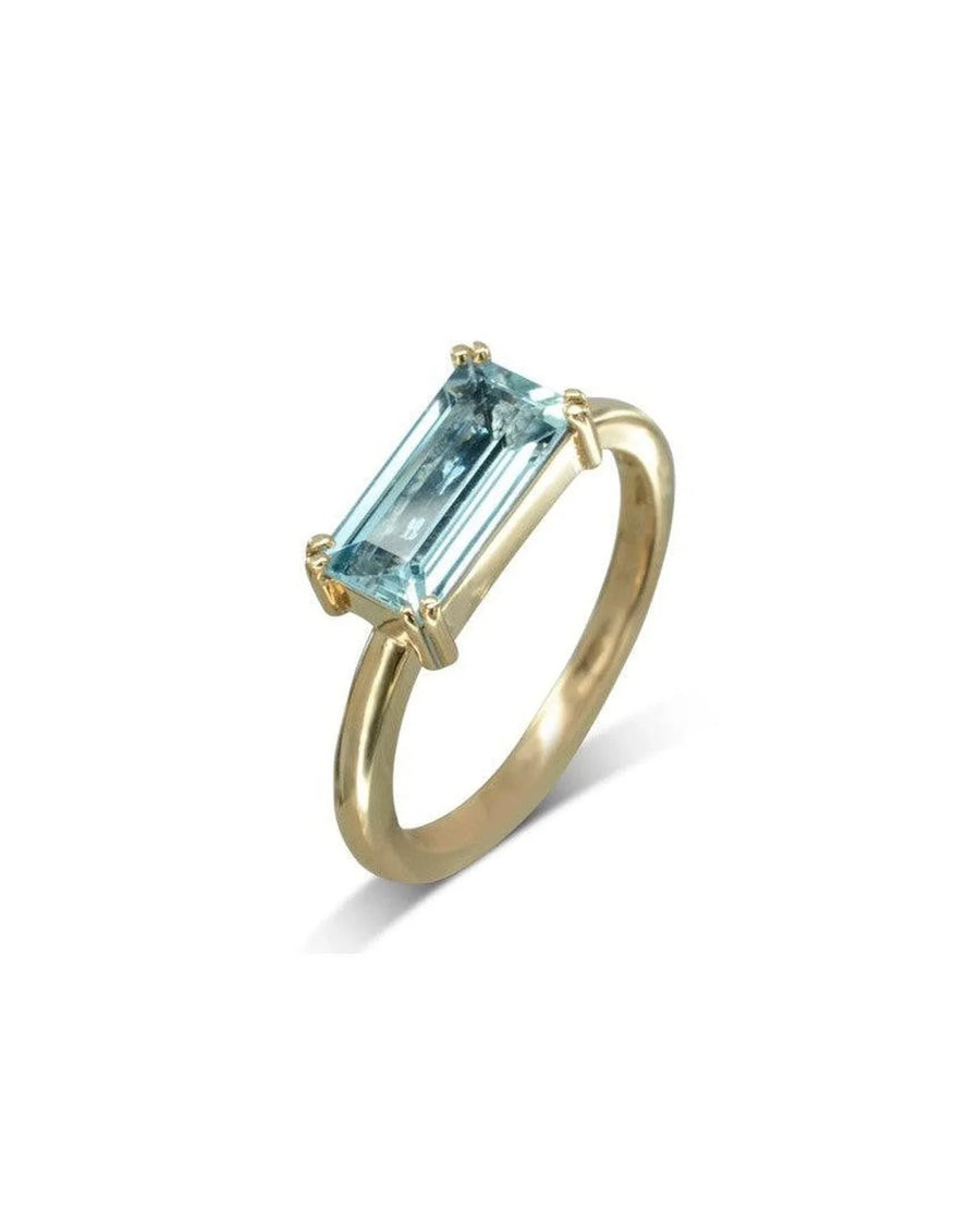 9ct yellow gold ring with a rectangular light blue gemstone.